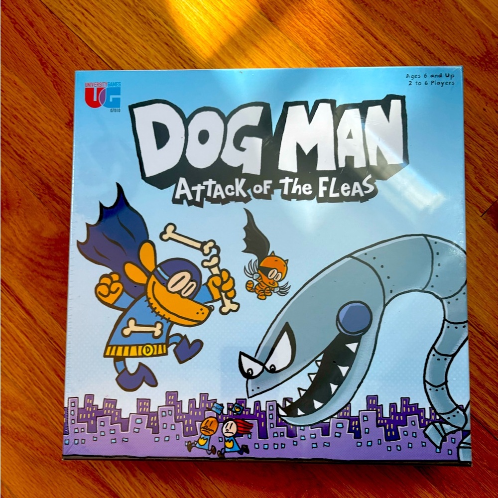 Dog Man Attack of the Fleas Game. 
New in Box! Still wrapped. Never opened.